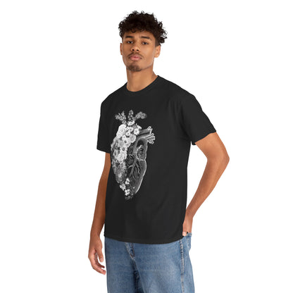 Stylish black graphic T-shirt worn by a model, featuring a striking floral heart design, epitomising an artistic blend of nature and anatomy in high fashion.