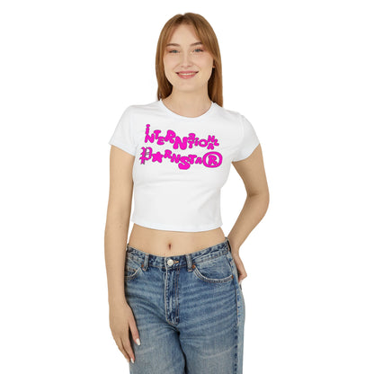 Elegant model wearing a fitted white crop t-shirt with bold pink 'INTERNATIONAL PARNSTAR®' graphic, perfect for casual outings or stylish occasions.