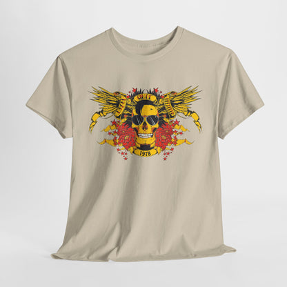 Luxurious Bold Yellow Skull Graphic T-Shirt displayed on a neutral backdrop, featuring striking wings, intricate floral designs, and retro 1978 text in a glamorous fashion.