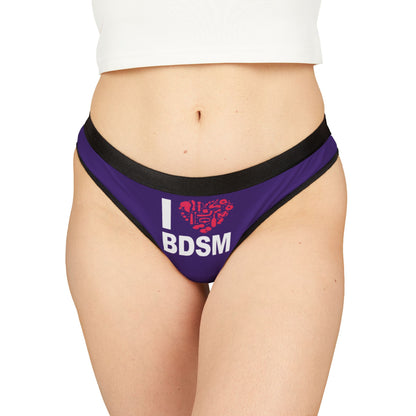 Elegant women's thong featuring a cheeky 'I ❤️ BDSM' design against a rich purple background, perfect for playful intimacy and making a bold statement.