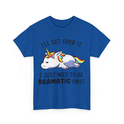Front view of a blue Unicorn Melancholy Graphic Tee featuring a delightful unicorn illustration alongside the humorous slogan, 'I’LL GET OVER IT, I JUST NEED TO BE DRAMATIC FIRST', ideal for geek chic fashion lovers.