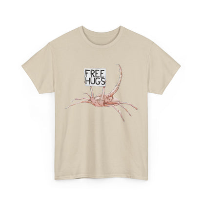 Front view of the exquisite Alien Xenomorph Facehugger Free Hugs Graphic Unisex Graphic Tee Shirt in a refined beige tone, featuring a whimsical facehugger graphic with 'Free Hugs' text.