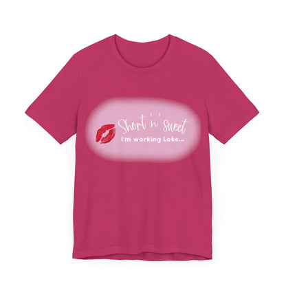Front view of a Sabrina Carpenter inspired unisex short sleeve tee featuring vibrant lipstick print, designed for stylish individuals.
