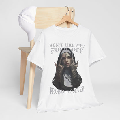 Chic white t-shirt styled alongside a cap, showcasing a rebellious tattooed nun design with the phrase 'Don't Like Me? FUCK OFF' and 'PROBLEM SOLVED', embodying contemporary streetwear aesthetics.