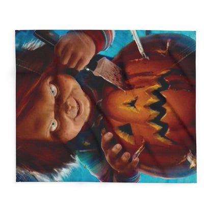 Charming Decorative and Warm Halloween Chucky Spooky Arctic Fleece Blanket featuring a detailed design of Chucky carving a jack-o'-lantern, perfect for seasonal décor.