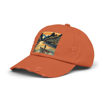 Unisex Distressed Paddleboarders Cap featuring a stunning fantasy design, perfect for stylish water adventures, showcasing a picturesque paddleboard scene against a vibrant sunset backdrop.