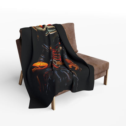 Luxurious Decorative and Warm Halloween Spooky Arctic Fleece Blanket elegantly draped over a modern chair, showcasing a captivating design featuring a spooky skeleton and Halloween-themed elements.