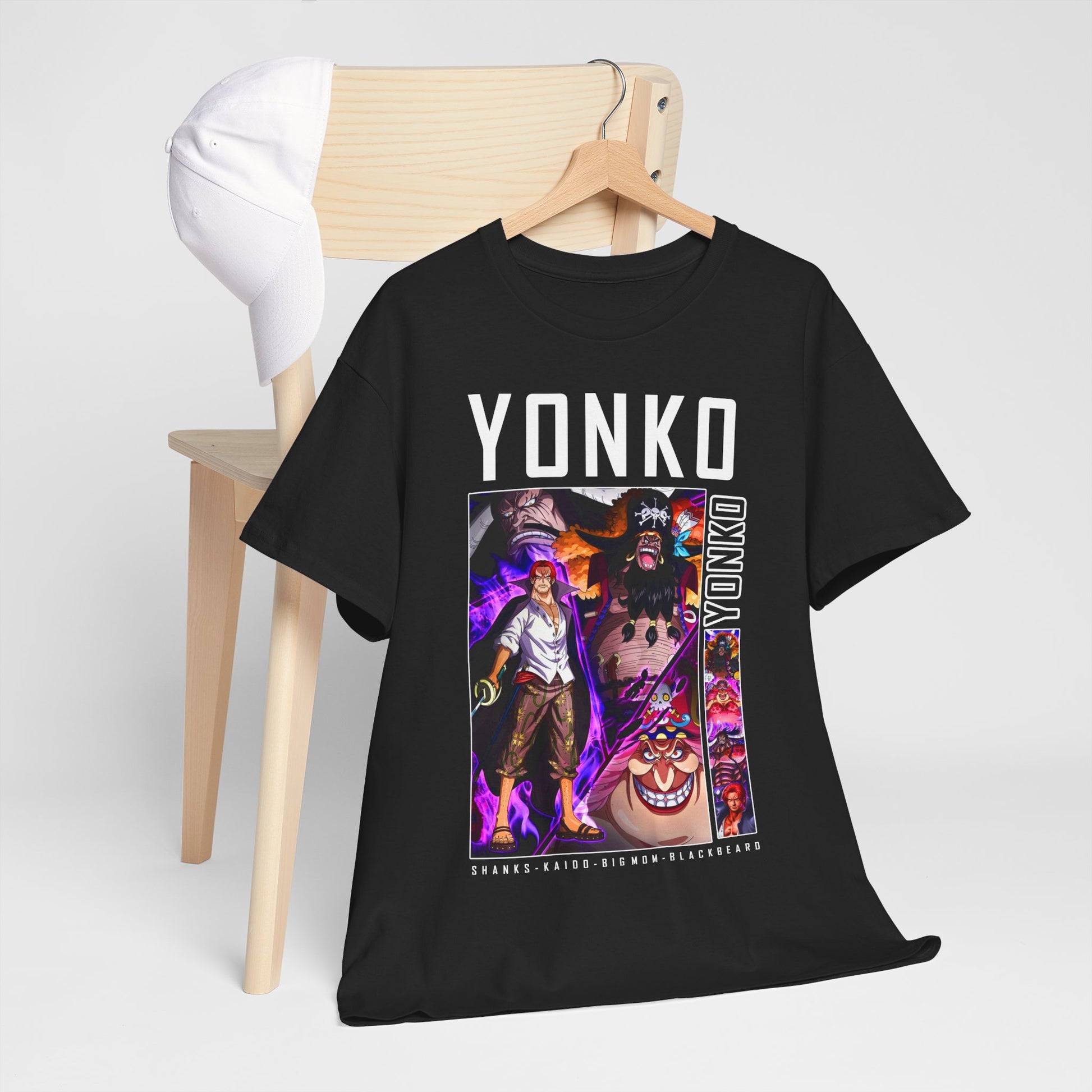Chic One Piece Yonko t-shirt displayed on a wooden chair next to a white cap, highlighting its vibrant print of beloved anime characters, a statement piece for luxury casual wear.