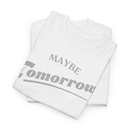 Folded white 'Maybe Tomorrow' graphic t-shirts, presented in a luxurious arrangement highlighting its soft fabric and elegant design.