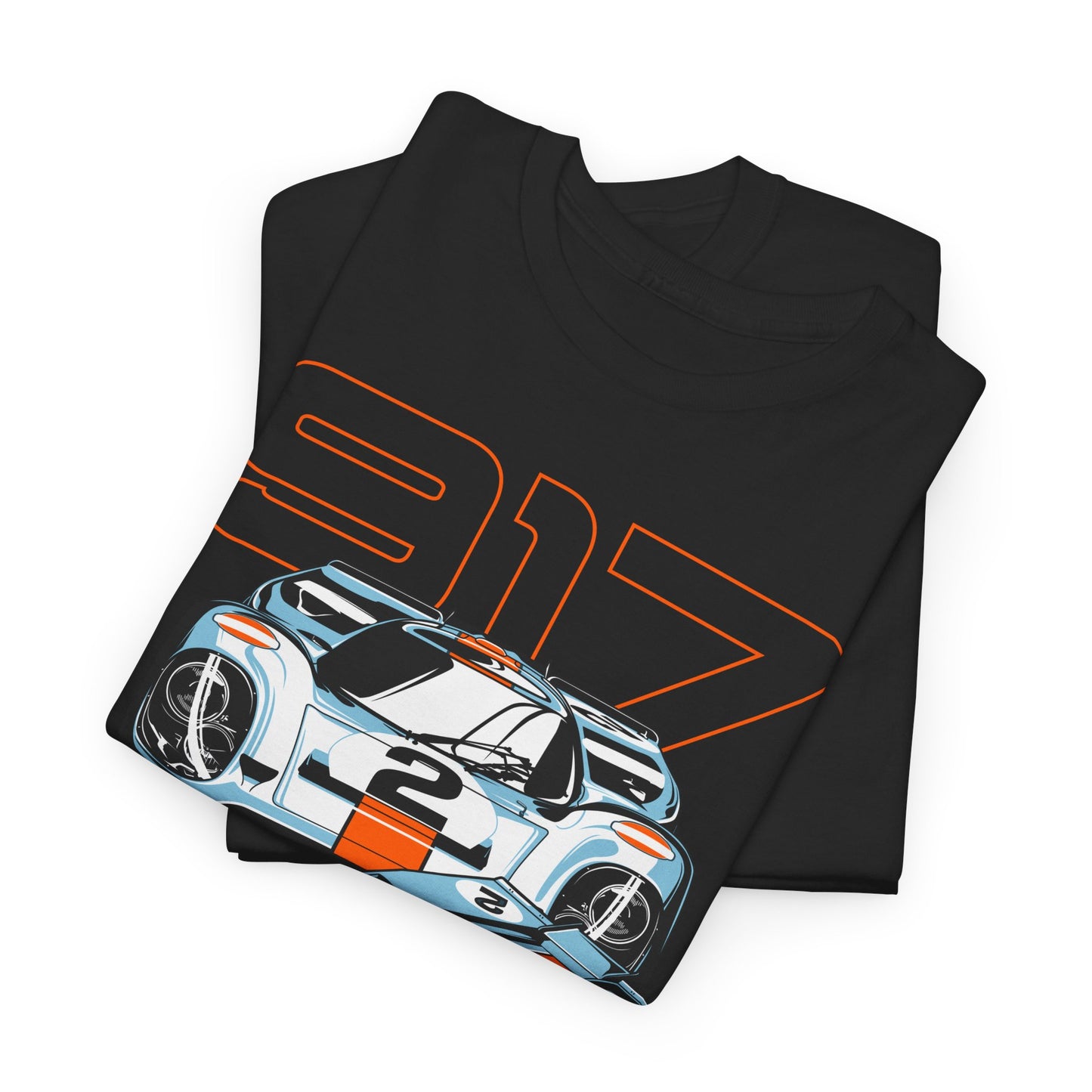 Folded black t-shirt with a striking Porsche 917 graphic, highlighting intricate detailing on legendary race cars, perfect for stylish car lovers.