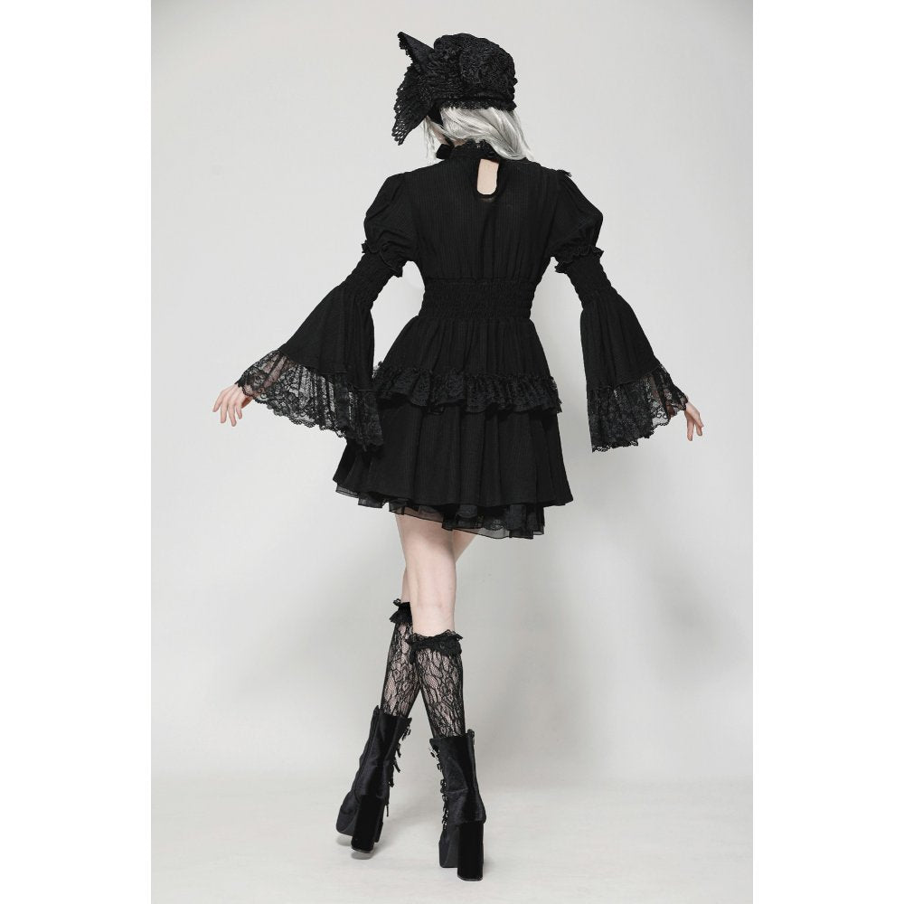 The Dark in Love Arya Gothic Doll Dress styled on a mannequin, demonstrating its elegant silhouette and luxurious textures for gothic fashion enthusiasts.