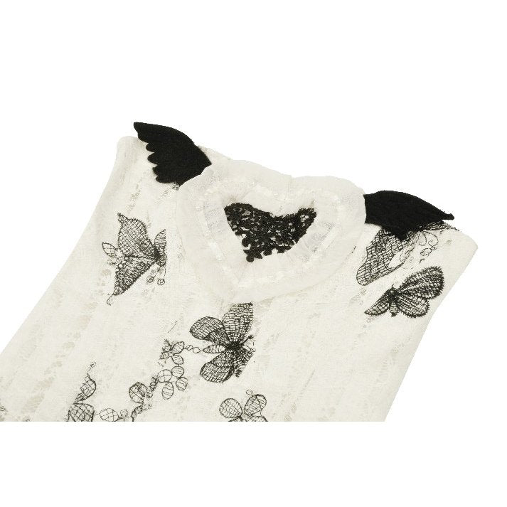 Model wearing the Dark in Love Zosia Black Butterfly Lace Dress in an enchanting outdoor setting, exuding gothic elegance.