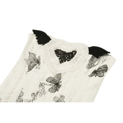 Model wearing the Dark in Love Zosia Black Butterfly Lace Dress in an enchanting outdoor setting, exuding gothic elegance.