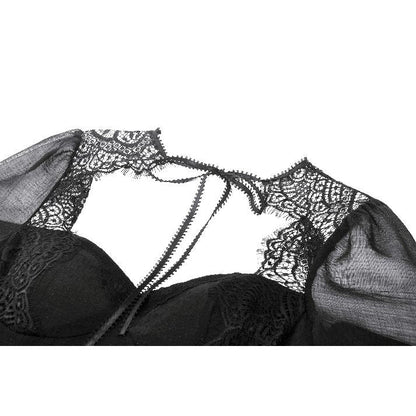 Model wearing the Dark in Love Greta Lace-Up Mesh Dress in an enchanting gothic setting, embodying dark elegance.