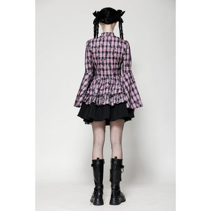 Model wearing the Dark In Love Ellery Dress in an outdoor setting, exemplifying its dramatic flair and luxurious design.