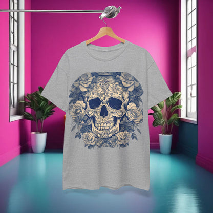 Styled image of the Skulls and Roses Cotton Tee, Unisex Graphic Shirt in grey, displayed in a vibrant interior, highlighting its unique design.