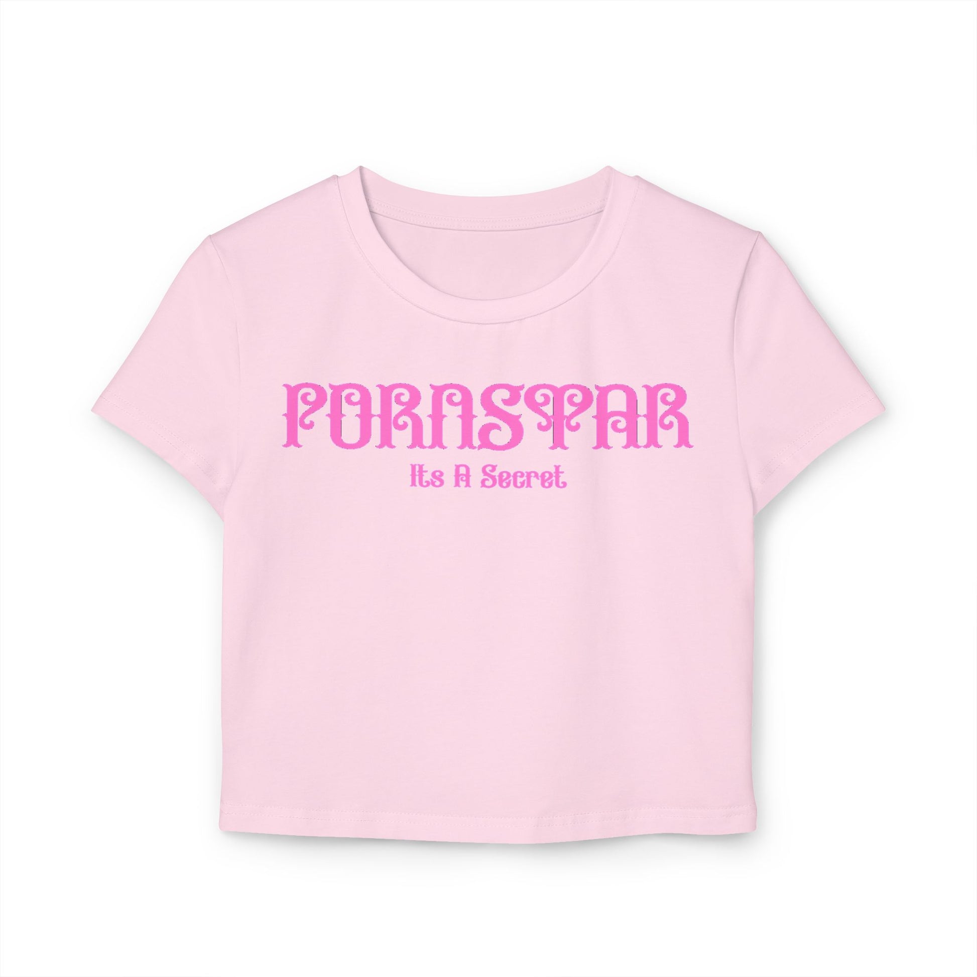 Cheeky women's cropped t-shirt in soft pink with stylish 'Pornstar' graphic and the phrase 'It's A Secret', crafted from 100% organic cotton for a sustainable fashion statement.
