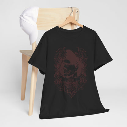 Stylish black men's t-shirt featuring a bold zombie graphic and baroque design, artfully presented alongside a classic white cap on a wooden chair.