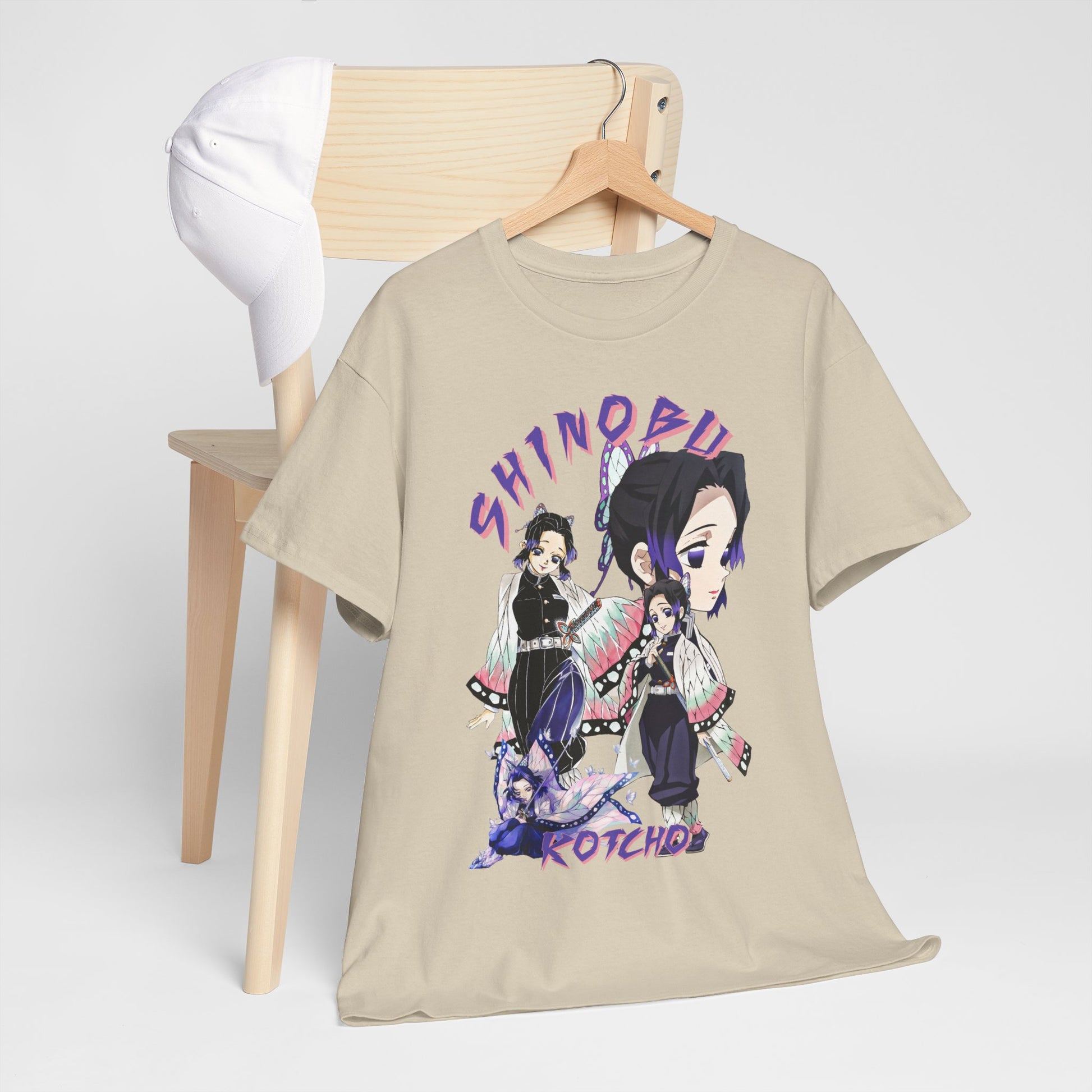 Sophisticated layout of a Shinobu Kocho T-shirt alongside a stylish cap on a chair, illustrating a trendy look for everyday casual wear for anime fans.
