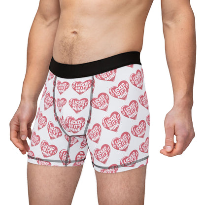 Stylish model wearing Valentines Naughty Cheeky Mens Boxer Briefs with eye-catching heart design, blending romance and humour for memorable gifting.