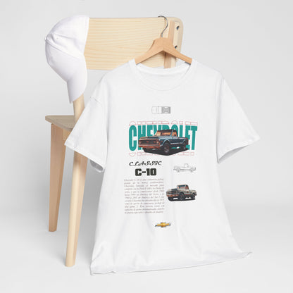 Chic Chevrolet C-10 Classic T-shirt resting on a wooden chair, paired with a cap, embodying a fashionable yet relaxed aesthetic.