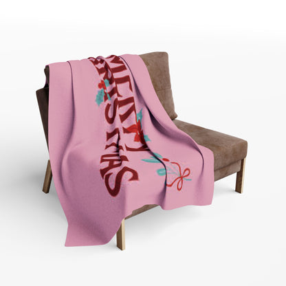 Decorative and Warm Christmas Arctic Fleece Blanket elegantly cascading on a contemporary armchair, capturing the essence of holiday comfort and style.