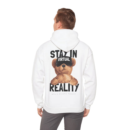 Stylish white hoodie adorned with an endearing teddy bear in VR goggles, modelled by a fashionable man, emphasizing casual elegance and playful fashion.