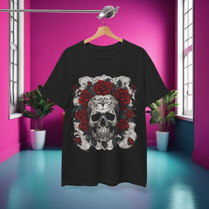 The Skulls and Roses Cotton Tee displayed in a fashion setting against a vibrant pink backdrop, emphasizing its artistic graphic of skulls adorned with roses.