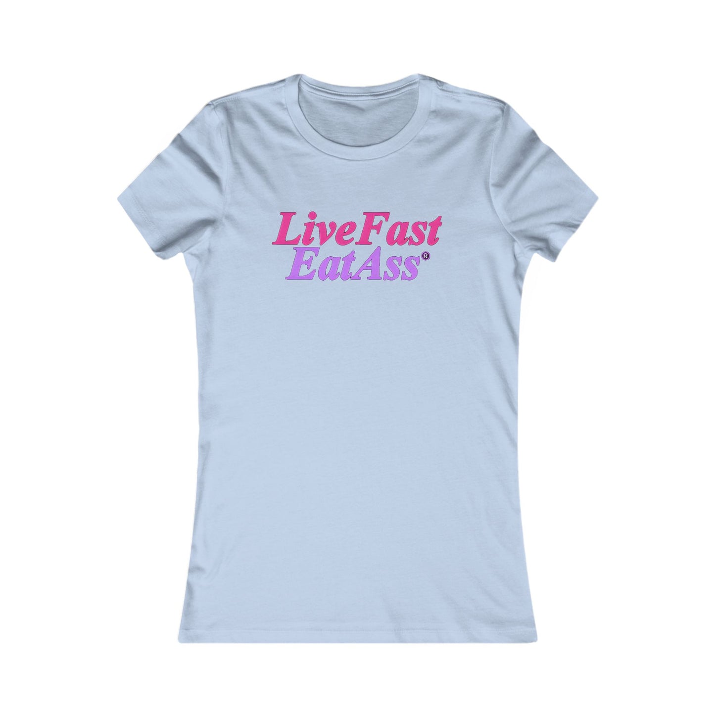 Charming light blue fitted t-shirt for women, displaying the eye-catching slogan 'Live Fast, Eat Ass®' in an elegant pink and purple gradient, perfect for a relaxed yet fashionable look.