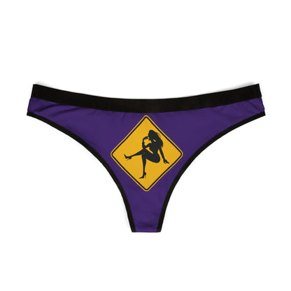 Luxurious purple women's thong adorned with a whimsical silhouette on a caution sign, perfect for adding a touch of fun to intimate apparel.
