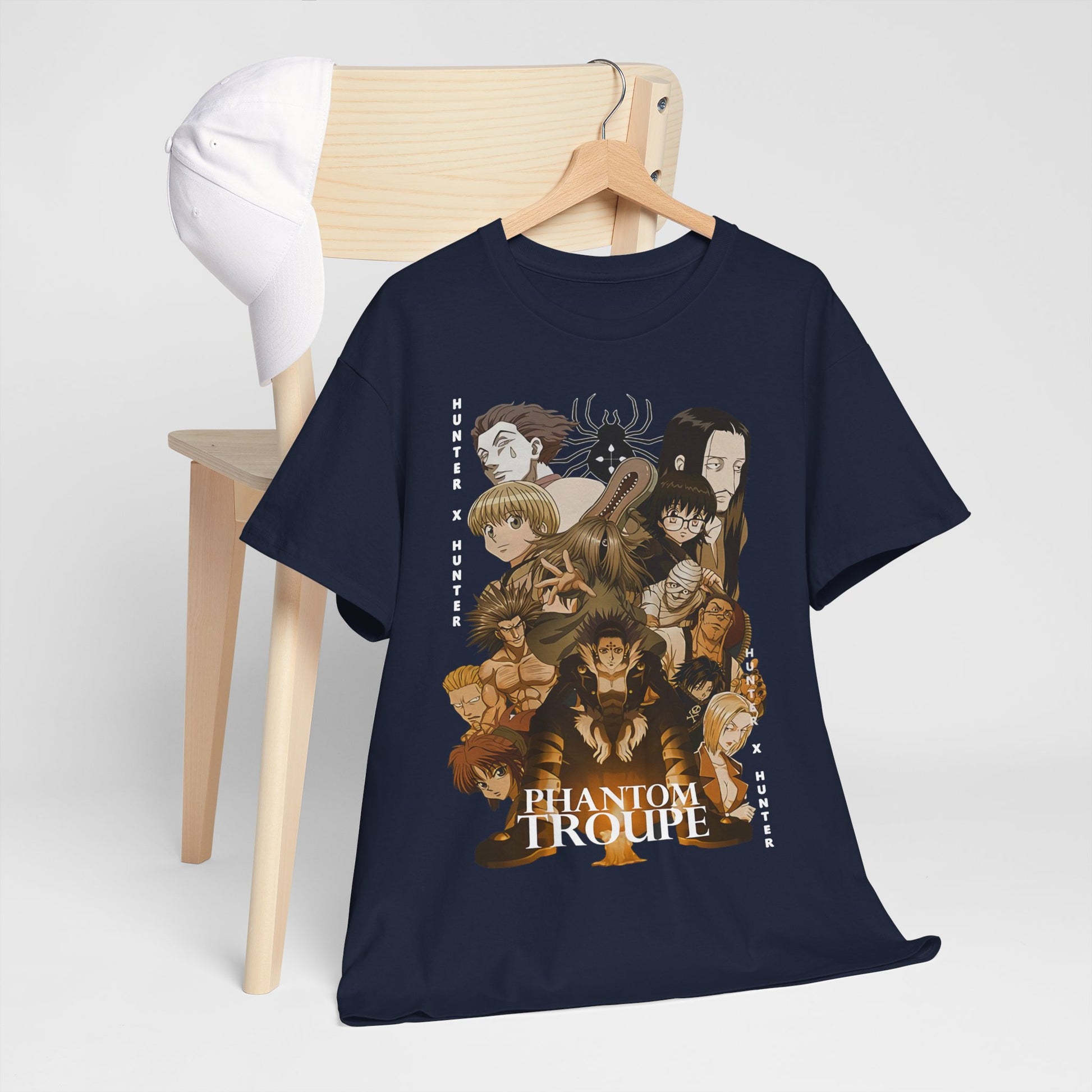 Elegant display of the Phantom Troupe anime t-shirt draped over a chair with a white cap, highlighting the rich design inspired by Hunter x Hunter.