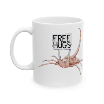 Alien Xenomorph Facehugger Free Hugs Funny Ceramic Mug design featuring a playful facehugger with a humorous ‘Free Hugs’ message, perfect for sci-fi fans and office banter.
