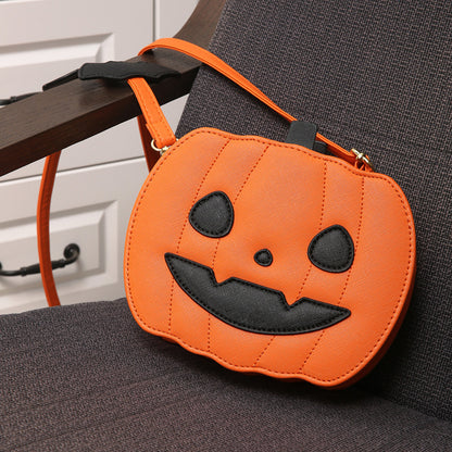 2023 Halloween Bags Funny Pumpkin Cartoon Shoulder Crossbody Bag presented elegantly on a chair, highlighting its unique pumpkin design and fashionable strap.
