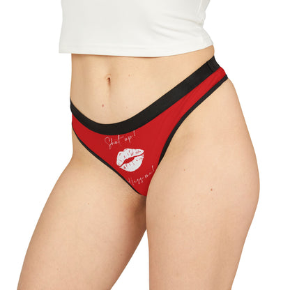 Chic red thong for women embellished with a fun slogan and lipstick mark, perfect for gifting and intimate moments.
