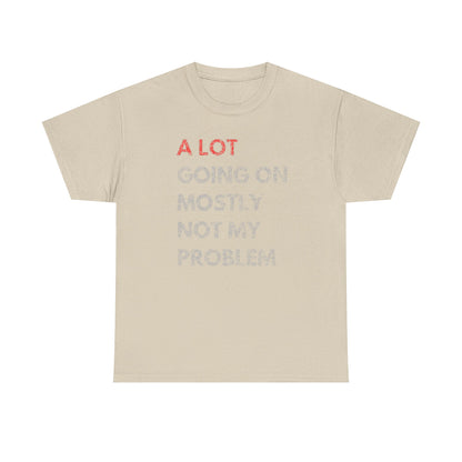 Elegant beige t-shirt featuring the humorous phrase 'A LOT GOING ON MOSTLY NOT MY PROBLEM' in bold red and soft grayish-white typography, embodying a casual luxury style.