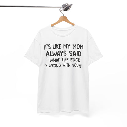 Stylishly hung Funny Mom Quote T-Shirt showcasing the iconic quote 'It's like my mom always said: What the fuck is wrong with you?!' in bold black print, embodying a luxurious blend of humour and fashion.
