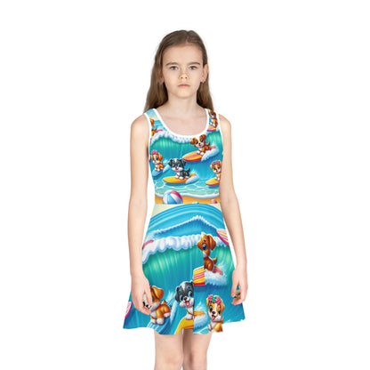 Lulu Bellefonte Girls Sundress worn by a young girl, featuring an enchanting surfing pups design, ideal for summer outings, highlighting playful dogs in a lively beach scene.