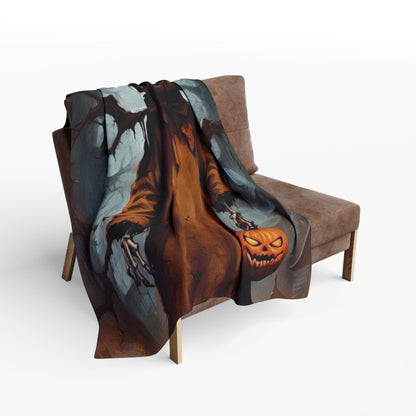 Chic Decorative and Warm Halloween Spooky Arctic Fleece Blanket draped over a chair, highlighting an enchanting pumpkin design that enhances your Halloween atmosphere.