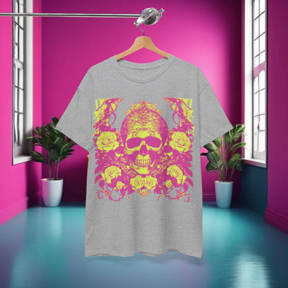 The chic Skulls and Roses Cotton Tee displayed elegantly on a hanger against a pink backdrop, highlighting its unique skull and floral design.