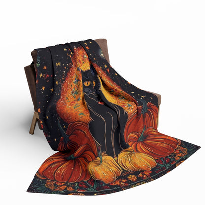 Decorative and Warm Halloween Spooky Arctic Fleece Blanket in an inviting pose on a modern chair, featuring a captivating black cat and pumpkins, designed for a stylish Halloween experience.