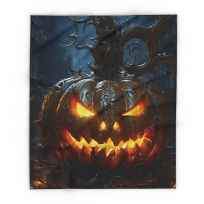 Gorgeous Decorative and Warm Halloween Spooky Arctic Fleece Blanket showcasing a strikingly crafted jack-o'-lantern in a haunting setting, ideal for sophisticated Halloween decor.