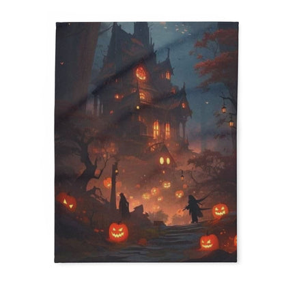A luxurious decorative Arctic fleece blanket featuring a mystical Halloween scene with glowing jack-o'-lanterns and a haunted house, perfect for the Halloween season.