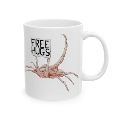 Close-up of the Alien Facehugger Free Hugs Ceramic Mug, featuring an endearing alien figure with 'Free Hugs' sign, great for adding fun to your kitchen.