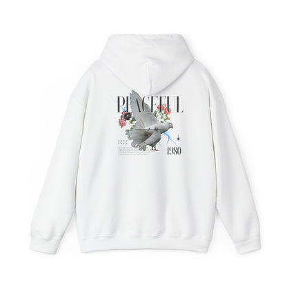Stylish white hoodie featuring a detailed back print of doves, roses, and the word 'PEACEFUL' in an elegant font, showcasing a vintage 1980 graphic design.