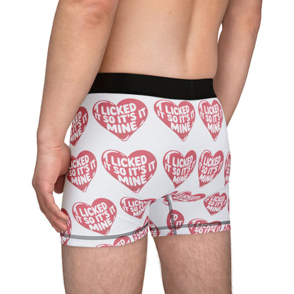 Side view of a man wearing Valentines Naughty Cheeky Men's Boxer Briefs, featuring humorous love-themed graphics, ideal for making a stylish statement on romantic occasions.