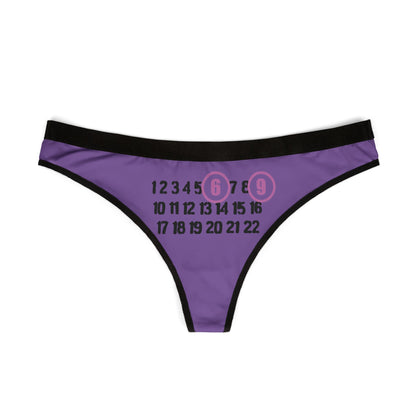 Luxurious cheeky thong featuring a playful '69' design on a vibrant purple background, accented by contrasting black waistband, perfect for bold fashion statements.