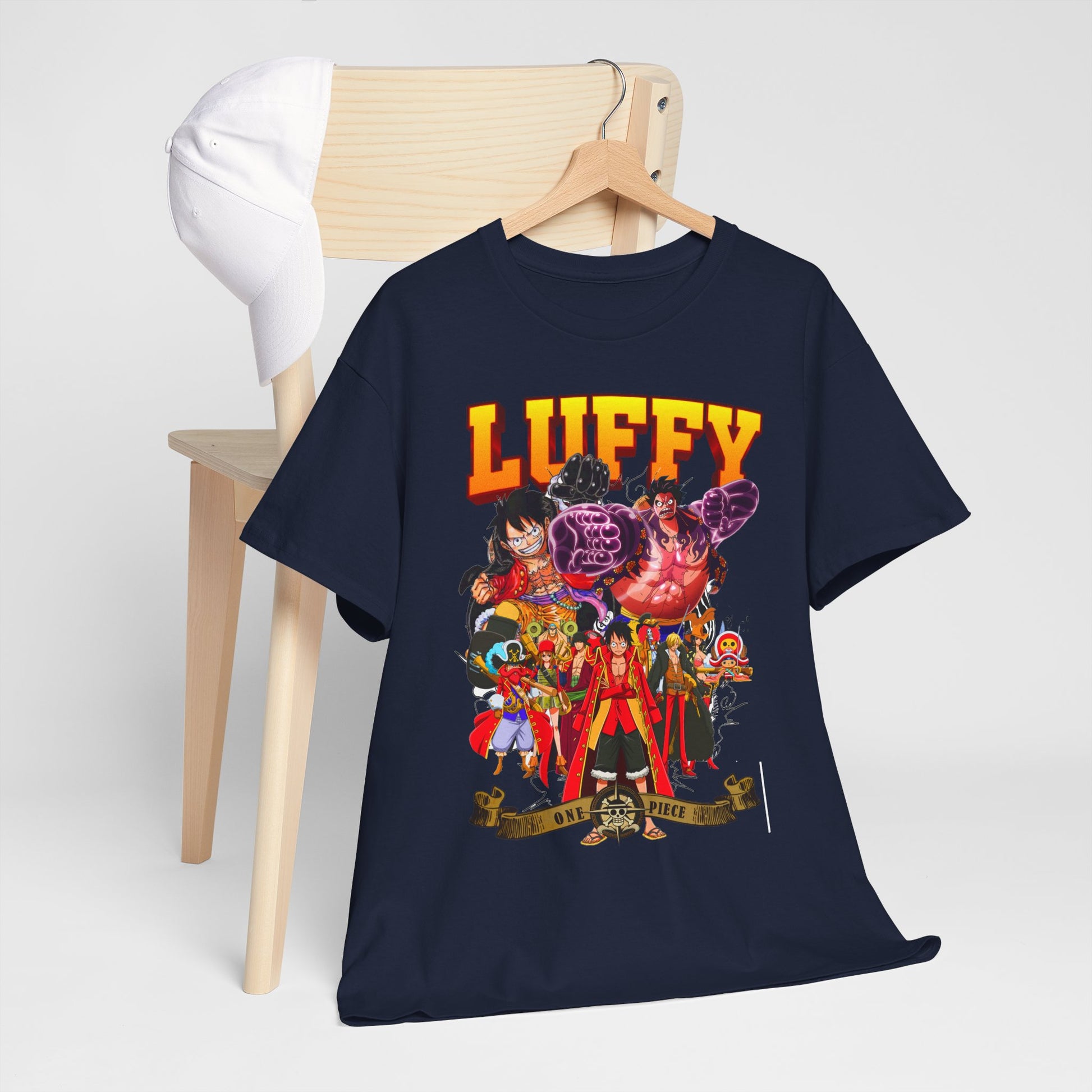 Stylishly draped navy blue t-shirt with a bold Luffy graphic, artfully displayed on a wooden chair, ideal for trendy anime enthusiasts.
