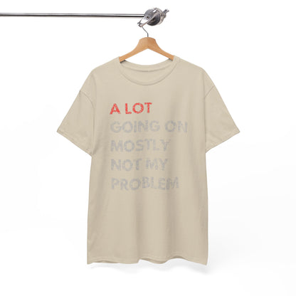 Sophisticated men's t-shirt hanging on a stylish hanger, showcasing the phrase 'A LOT GOING ON MOSTLY NOT MY PROBLEM' in a fashionable design, perfect for upscale casual outings.