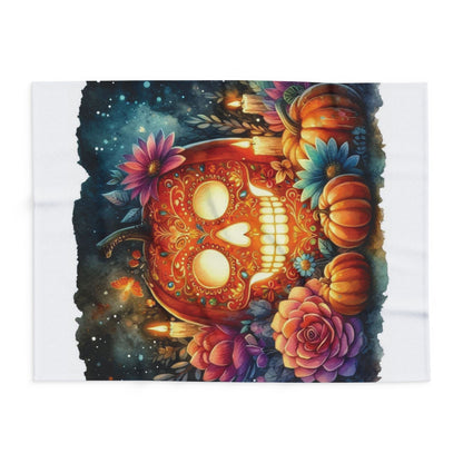 Exquisite Arctic fleece blanket featuring an artistic pumpkin skull surrounded by colourful flowers, a splendid choice for Halloween ambience.