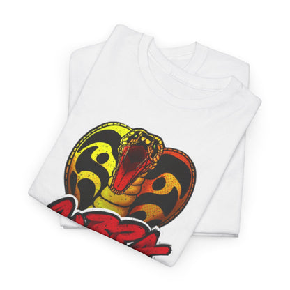 Folded white t-shirts displaying a prominent Cobra Kai snake graphic, embodying street-style elegance with a nod to martial arts culture.